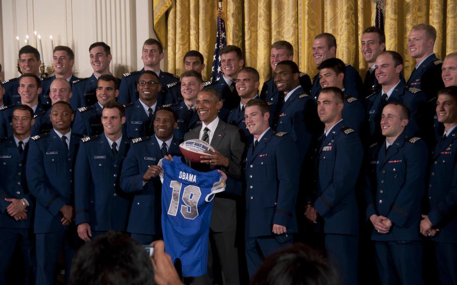 The Air Force Academy football team poses with President Barack Obama at the White House on May 7, 2015. The Air Force Falcons beat the Army team 23-6 in November to win the Commander-in-Chief's Trophy, which Obama presented during the ceremony.