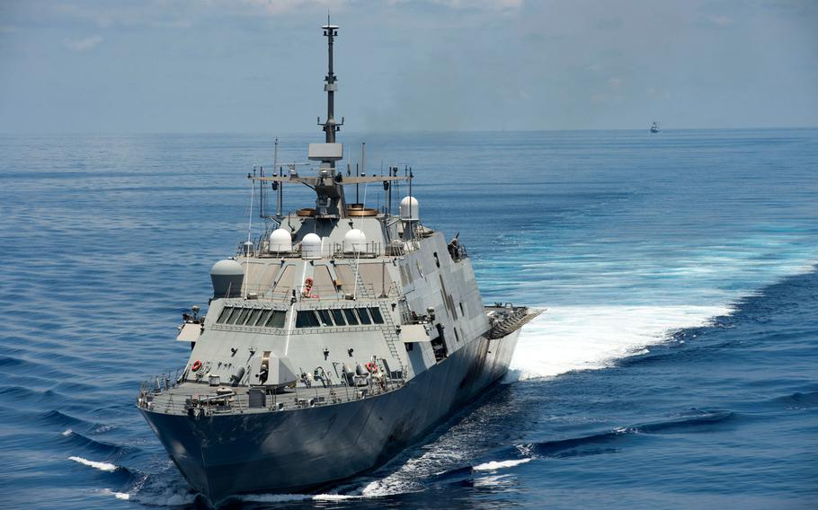 The littoral combat ship USS Fort Worth patrols in international waters of the South China Sea near the Spratly Islands as the Chinese guided-missile frigate Yancheng follows in the distance on Monday, May 11, 2015.