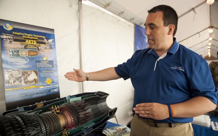 John Cox, an engineer at the Air Force Research Laboratory, shows off a new jet engine that offers more boost and yet is more fuel efficient at DOD Lab Day at the Pentagon on May 14, 2015.