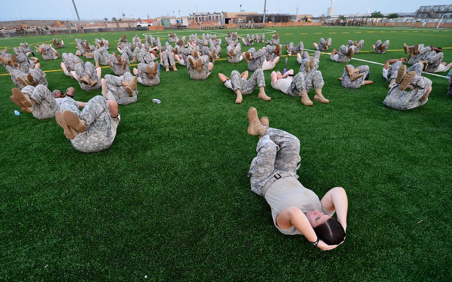 Combined Joint Task Force-Horn of Africa service members perform sit-ups during enlisted physical training at Camp Lemonnier, Djibouti, May 15, 2015.