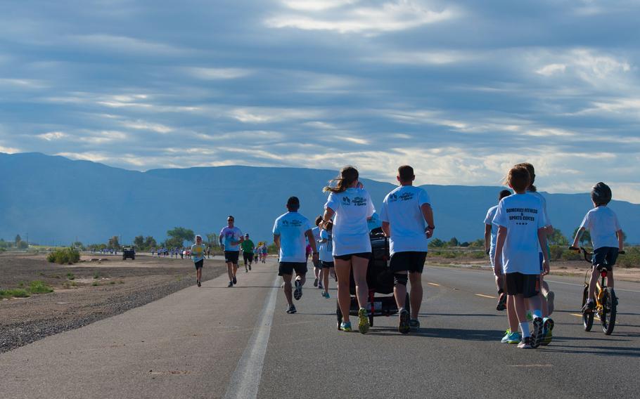 Team Holloman members and their dependents participate in the Art Blast Color 5K Run at Holloman Air Force Base, N.M., May 16, 2015. The Domenici Fitness Center hosts monthly fun runs to help boost morale and get members of Team Holloman enthused about getting and staying fit.