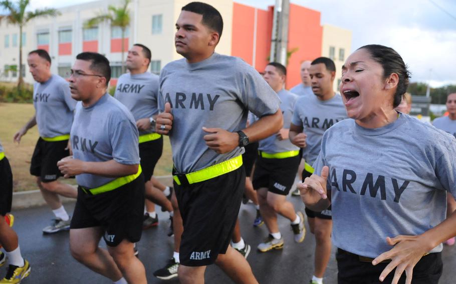 Sgt. 1st Class Betsy Cuevas, Human Resources Noncommisioned officer assigned to the 448th Engineer Battalion, U.S. Army Reserve-Puerto Rico, keeps the soldiers on step by singing cadences, during the 2015 Armed Forces Run at Fort Buchanan, Puerto Rico, May 15, 2015.