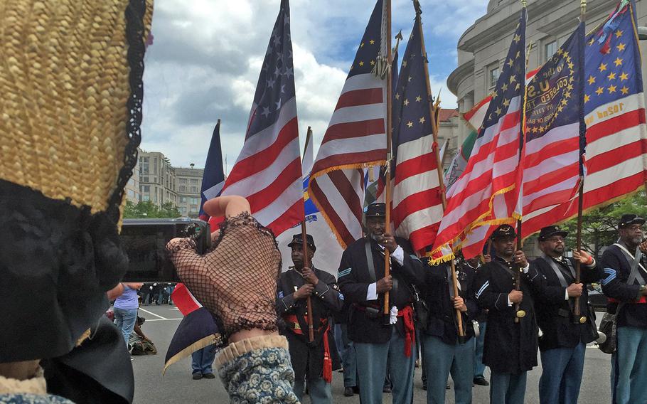 Reenactors march by in Washington, D.C., on Sunday, May 17, 2015, as part of the Grand Review Parade celebrating its 150 year anniversary.