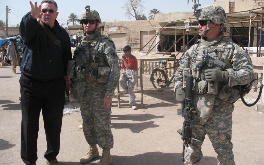 Retired Gen. Jack Keane talks to Lt. Col. Jack Marr commander of 1st Battalion, 15th Infantry Regiment, attached to 3rd Heavy Brigade Combat Team, 3rd Infantry Division, during a patrol though Salman Pak, Iraq, March 20, 2008. 