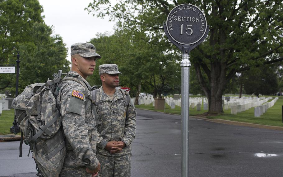 Members of The Old Guard wait for fellow servicemembers before starting Flags-In at Arlington National Cemetery on May 21, 2015.