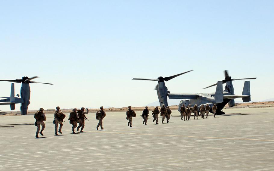 Marines with 1st Battalion, 7th Marine Regiment run to a waiting MV-22 Osprey at Marine Air Ground Combat Center Twentynine Palms, Calif., for a long-range raid exercise that incorporated a new system designed to allow infantry troops better communication with commanders and aircraft.