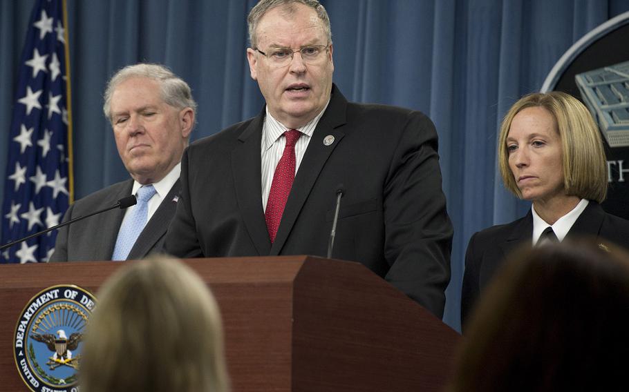U.S. Deputy Defense Secretary Bob Work, center, Under Secretary of Defense for Acquisition, Technology and Logistics Frank Kendall, and Director of Medical Programs for DoD Chemical and Biological Defense Cmdr. Franca Jones, conduct a press briefing on the DoD Lab Review and Anthrax shipment investigation June 3, 2015.