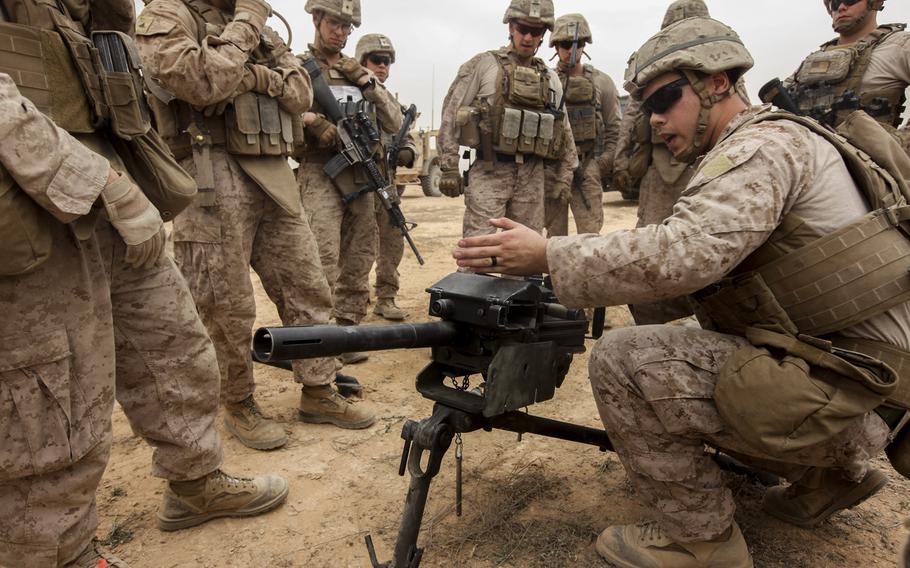 U.S. Marine Pfc. Rieg with Kilo Company, 3rd Battalion, 7th Marine Regiment, attached to Task Force Al Asad, gives a class on the different weapons conditions of the Mk 19 automatic grenade launcher before conducting a live-fire range aboard Al Asad Air Base, Iraq, June 1, 2015. Task Force Al Asad supports Combined Joint Task Force - Operation Inherent Resolve's Building Partner Capacity mission, which aims to increase the military proficiency of Iraqi Security Forces fighting the Islamic State.