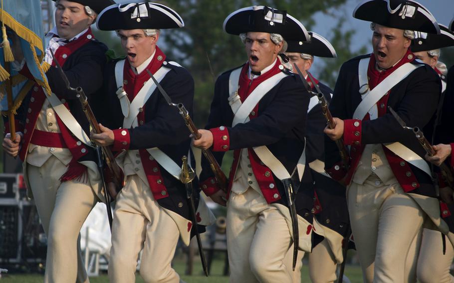 Re-enactors storm the field at Joint Base Myer-Henderson Hall in Arlington, Va., on June 10, 2015, as part of the Twilight Tattoo.