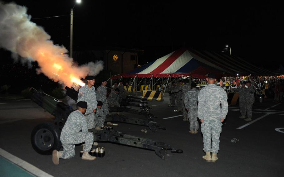 Battery C, 3rd Battalion, 16th Field Artillery Regiment fired its 75 mm howitzers on cue during the playing of the finale to Tchaikovsky's 1812 Overture at the Independence Day Celebration and Salute to the Nation Ceremony on Camp Casey, South Korea on July 4, 2015.