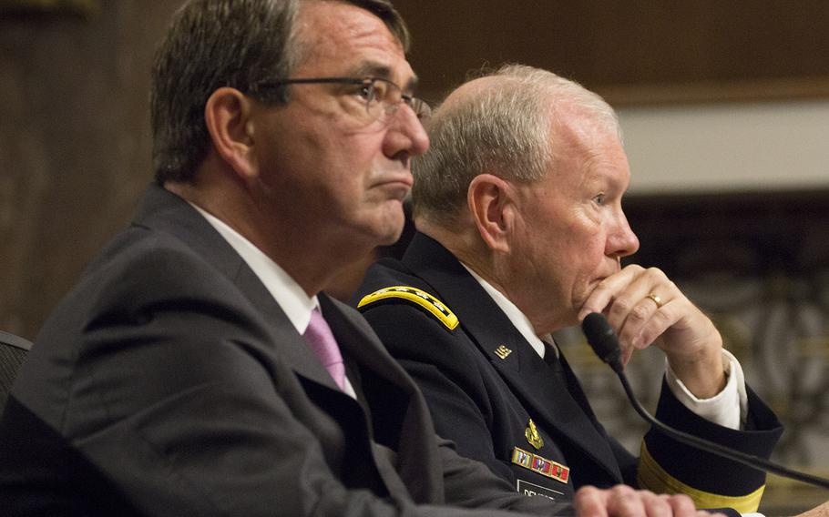 Secretary of Defense Ash Carter and Joint Chiefs of Staff Chairman Gen. Martin Dempsey listen to opening statements at a Senate Armed Services Committee hearing on counter-Islamic State strategy, July 7, 2015.