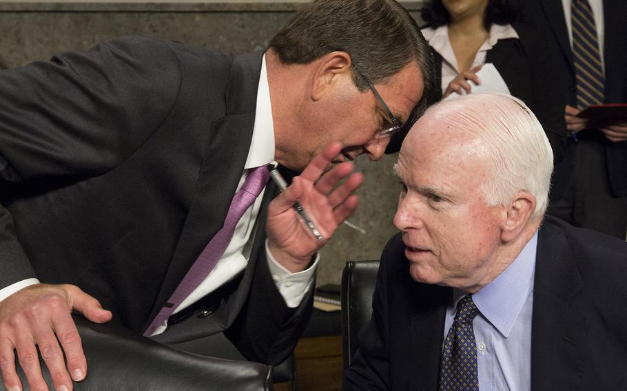 Secretary of Defense Ash Carter talks with Senate Armed Services Committee Chairman Sen. John McCain, R-Ariz., before a hearing on counter-Islamic State strategy, July 7, 2015.