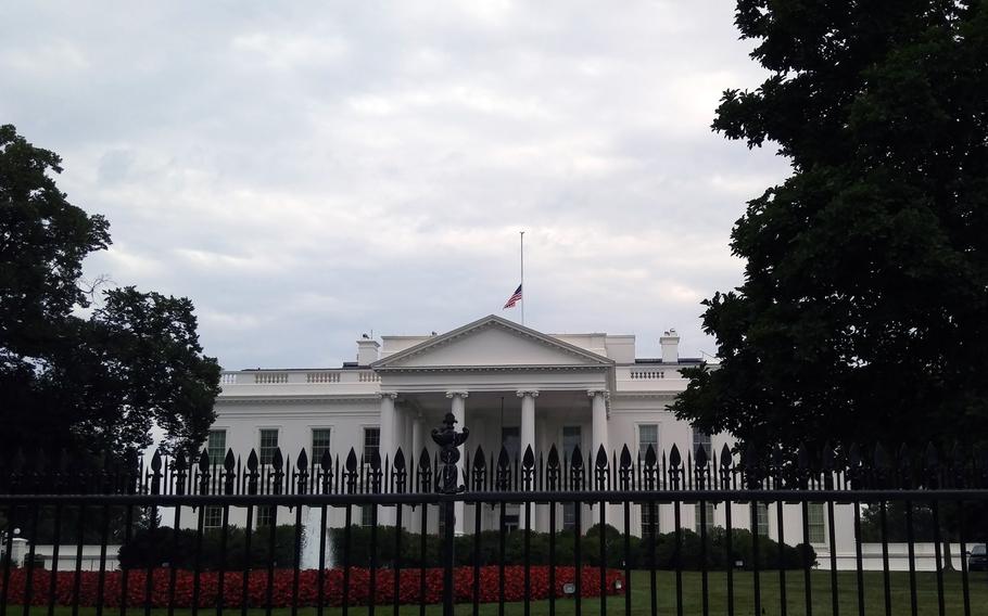 The American flag flies at half-staff at the White House in honor of the Chattanooga shooting victims on July 21, 2015.