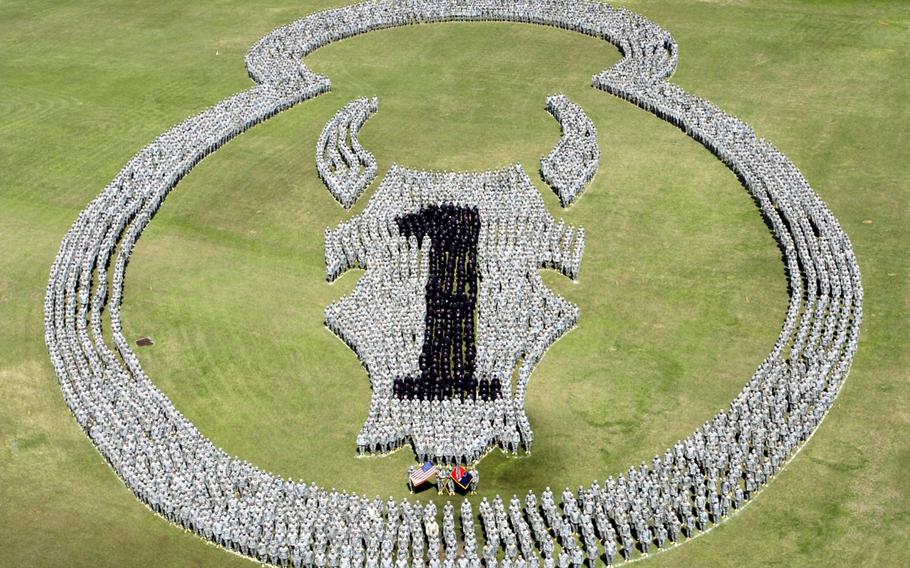More than 4,000 troops of the 1/34th Brigade Combat Team assemble in special formation during a farewell ceremony at Camp Shelby, Miss., March 16, 2006. Law enforcement officials in Mississippi said Tuesday, Aug. 4, 2015, they are searching for suspects who shot at soldiers training at the base.