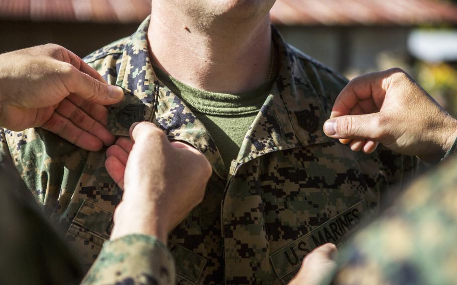 A Marine is promoted to the rank of Gunnery Sergeant on Soto Cano Air Base, Honduras, Aug. 1, 2015. 