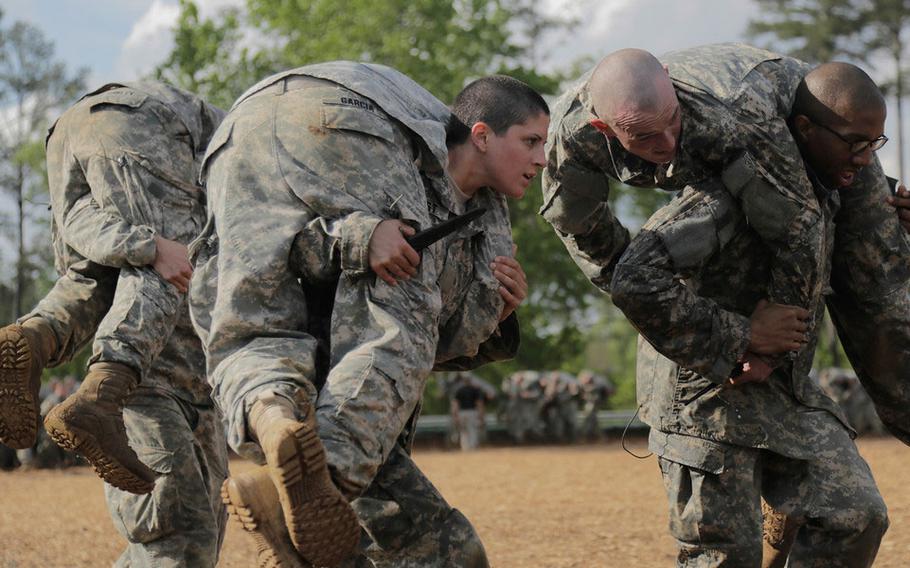 Soldiers participate in combatives training during the first gender-integrated Ranger Course on Fort Benning, Ga., April 20, 2015.