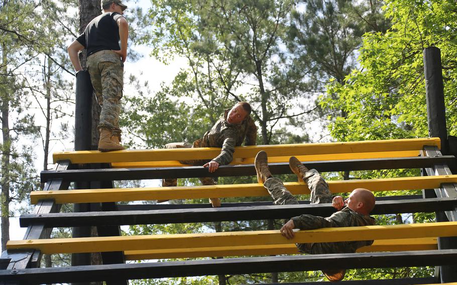 Soldiers negotiate the Darby Queen obstacle course during the Ranger Course on Fort Benning, Ga., on April 26, 2015. 