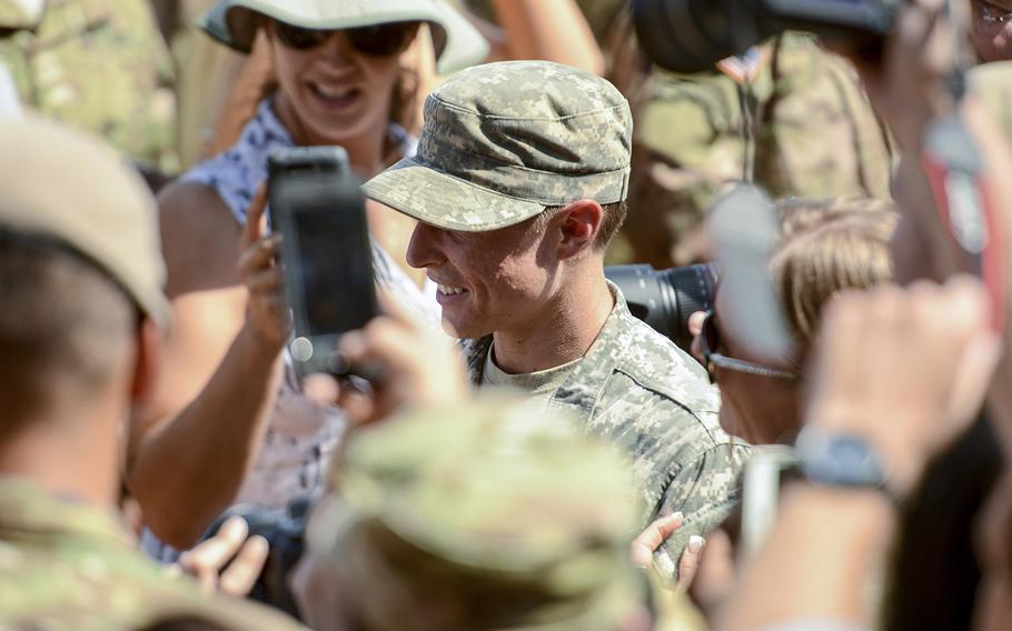 1st Lt. Shaye Haver stands amidst a crowd during her Ranger School graduation on Aug. 21, 2015.