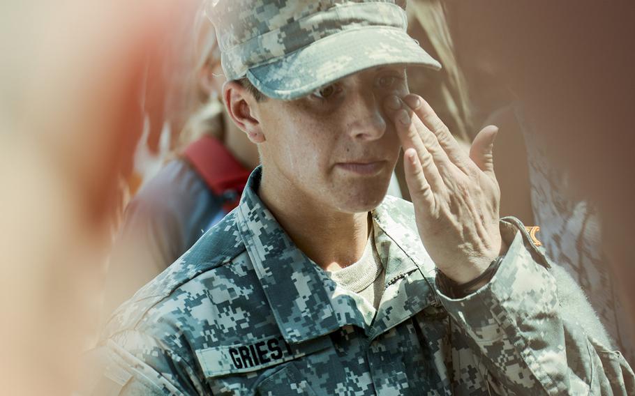 Capt. Kristen Griest wipes away a tear after earning her Ranger Tab on Aug. 21, 2015.