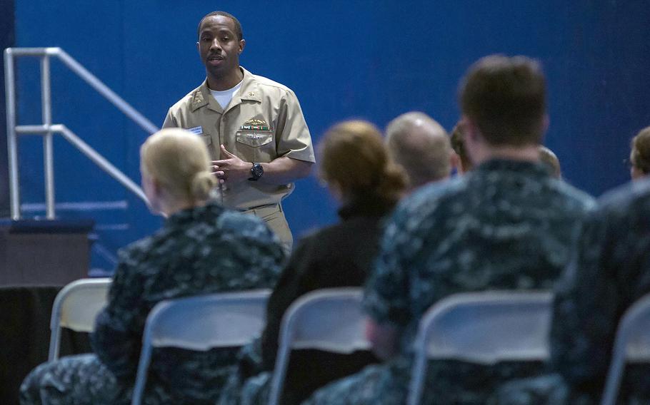 Lt. Cmdr. James Drumgole speaks to female sailors who are interested in converting to the submarine community.