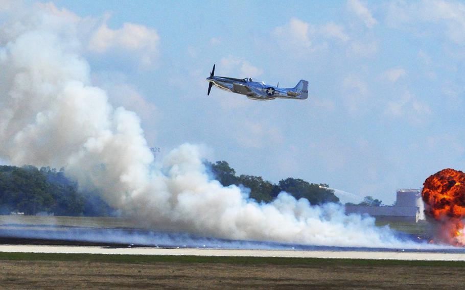 A P-51 Mustang is part of a war demonstration at the 2015 Joint Base Andrews Air Show. The show attracted over 10,000 attendees after a three year hiatus. 