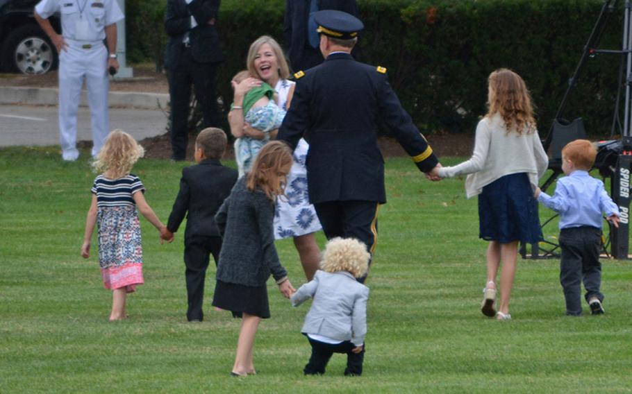Retiring Chairman of the Joint Chiefs of Staff Gen. Martin Dempsey walks with family members during his retirement ceremony at Joint Base Myer-Henderson Hall, Va., Sept. 25, 2015.