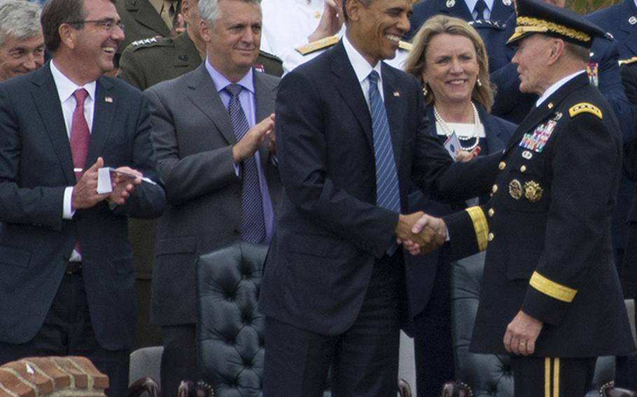 President Barack Obama shakes hands with retiring Chairman of the Joint Chiefs of Staff Gen. Martin Dempsey during Dempsey's farewell ceremony at Joint Base Myer-Henderson Hall, Va., Sept. 25, 2015.
