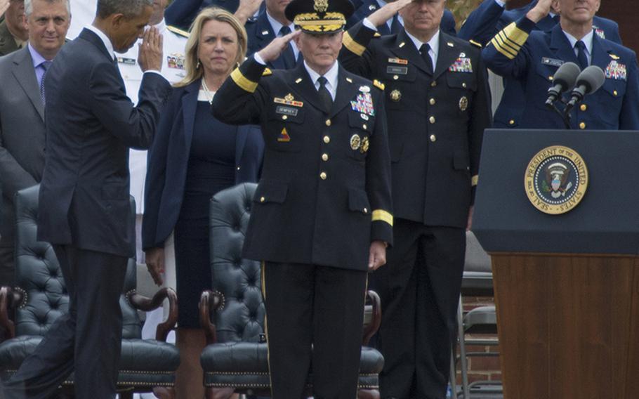 President Barack Obama salutes during the farewell ceremony for retiring Chairman of the Joint Chiefs of Staff Gen. Martin Dempsey at Joint Base Myer-Henderson Hall, Va., Sept. 25, 2015.