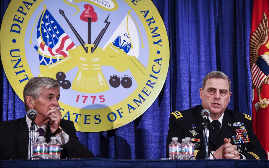 Secretary of the Army John McHugh, left, and Army Chief of Staff Gen. Mark Milley speak at the AUSA convention in Washington, D.C., Oct. 12, 2015.
