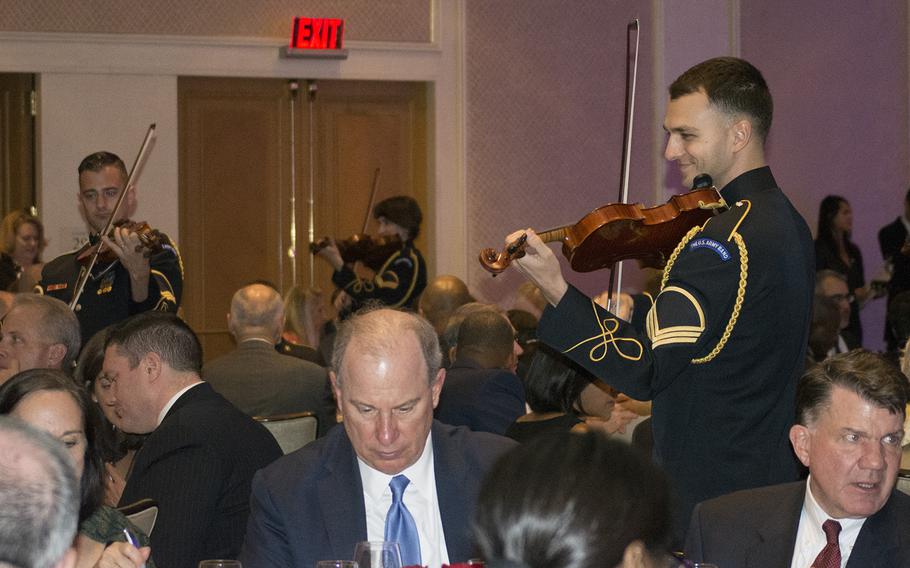 Members of the U.S. Army Strolling Strings band perform among the attendees at the Angels of the Battlefield Gala in Washington, D.C., on Nov. 4, 2015.