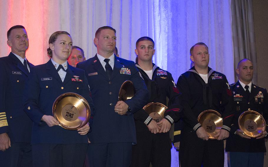 The honorees at the 13th annual Angels of the Battlefield Gala, hosted by the Armed Services YMCA, from left to right, are: Coast Guard Petty Officer 2nd Class Mya Dejanakul, Air Force Staff Sgt. Christopher Dixon, Navy Petty Officer 1st Class Wayne Papalski, Navy Petty Officer 1st Class Joshua Van Horn, and Army Sgt. 1st Class Adam Morelli. 