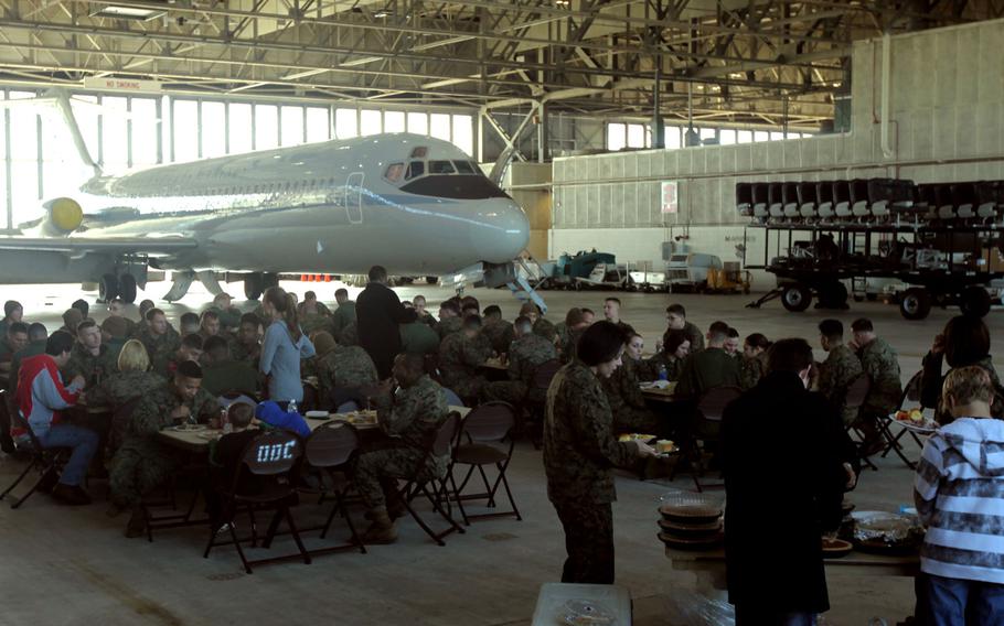 Marines and Sailors of Marine Transport Squadron 1 enjoy a Thanksgiving lunch at Marine Corps Air Station Cherry Point, N.C., Nov. 25, 2015. This is the fourth year that the Havelock community has come to the air station to offer the squadron a Thanksgiving meal as a way to show their thanks for all that the Marines do.
