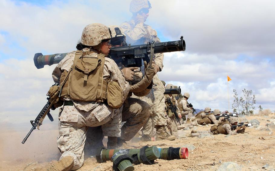 Marine Sgt. Emma Bringas joins other Marines in firing the MK153 shoulder-launched multipurpose assault weapon on March 2, 2015, during a Ground Combat Element Integrated Task Force pilot test at Twentynine Palms, Calif.