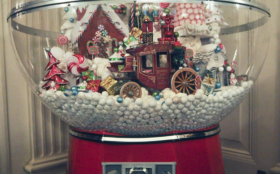 A gumball machine adorns a corner of the State Dining Room at the White House. First Lady Michelle Obama hosted a preview of White House decorations for military families on Dec. 2, 2015.