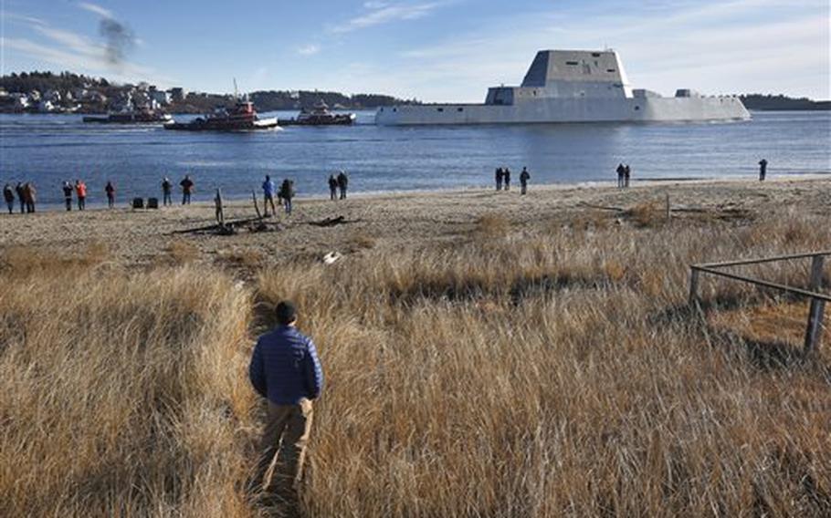 The first Zumwalt-class destroyer, the USS Zumwalt, the largest ever built for the U.S. Navy, leaves the Kennebec River, Monday, Dec. 7, 2015, in Phippsburg, Maine. The ship is headed out to sea for the first time to undergo sea trials. 