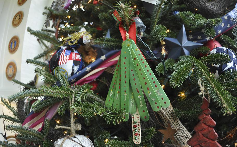 An ornament created by a military child at Kadena Air Force Base, Okinawa, Japan, adorns a military-themed Christmas tree at the Vice President's residence on Dec. 9, 2015. Second Lady Jill Biden visited the children earlier in the year.