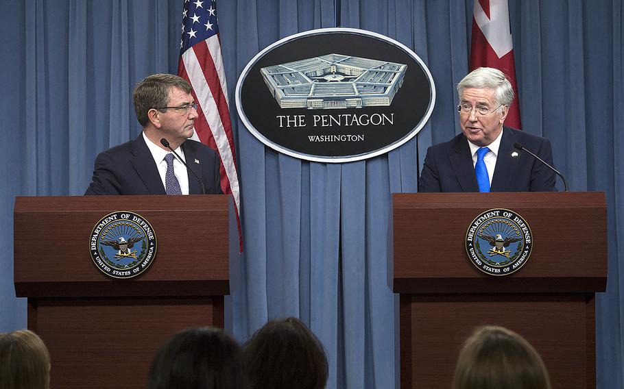 U.S. Defense Secretary Ash Carter and British Defense Secretary Michael Fallon conduct a joint news conference at the Pentagon Dec. 11, 2015.