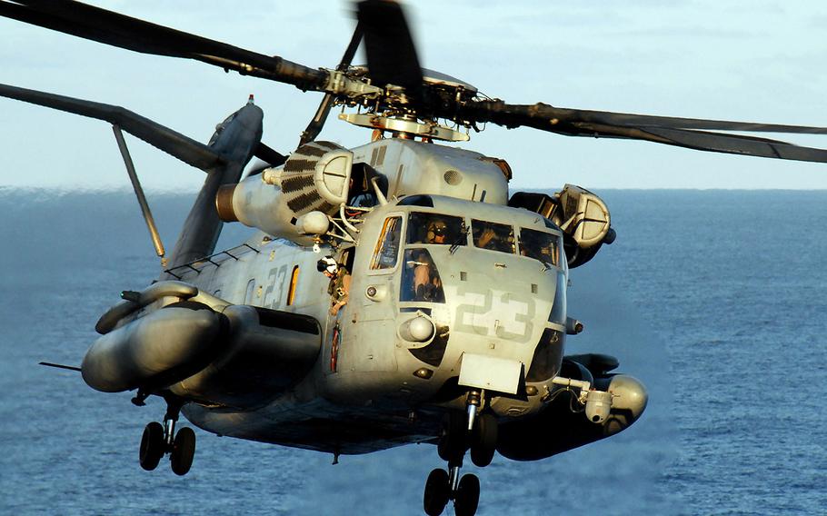 In a 2008 file photo, a CH-53E Super Stallion helicopter assigned to Marine Medium Helicopter Squadron 165 lands on the flight deck of the amphibious assault ship USS Peleliu.
