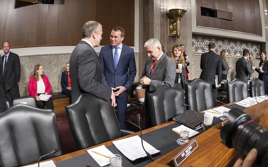 Eric Fanning greets senators before the start of a Senate Committee on Armed Services hearing Thursday, Jan. 21, 2016, on Capitol Hill in Washington, D.C., where committee members considered his nomination to become the next secretary of the Army.