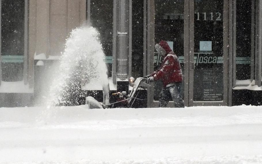Clearing snow in Washington, D.C., Saturday, Jan. 23, 2016.
