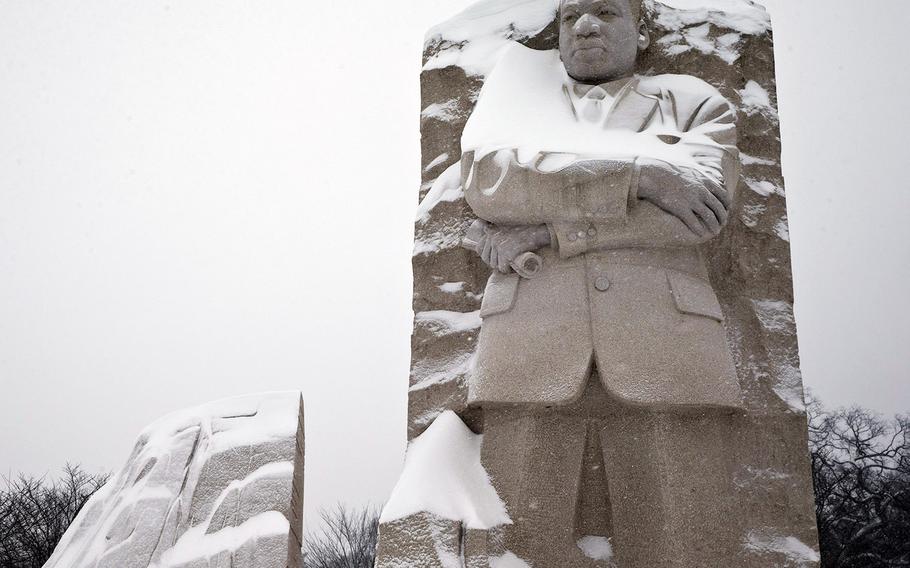 The Martin Luther King, Jr. Memorial has a coating of snow, Saturday, Jan. 23, 2016 in Washington.