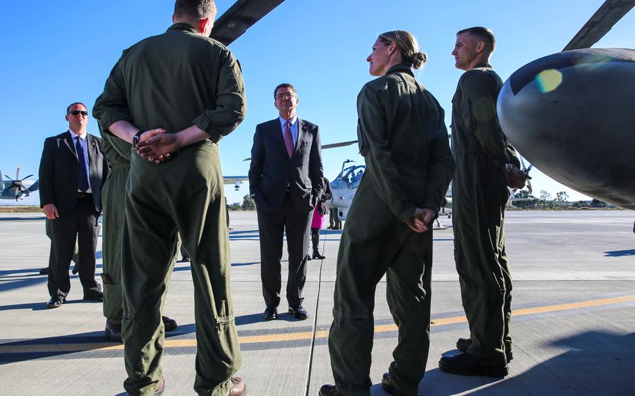 Secretary of Defense Ashton Carter talks to Marines while touring aircraft during his visit aboard Marine Corps Air Station Miramar, Calif., Feb. 3. During his time aboard station, he also conducted a troop talk and answered questions from Marines.
