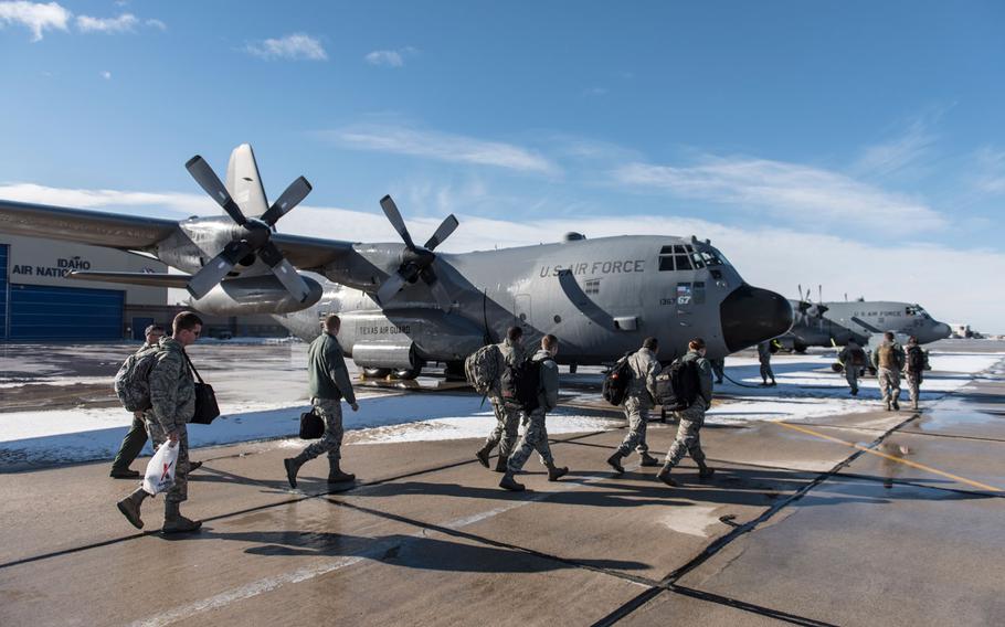 Airmen from the 124th Fighter Wing board a C-130 at Gowen Field, Boise, Idaho enroute to Nellis Air Force Base, Nev., on Jan. 14, 2016. The 124th FW, along with A-10C Thunderbolt IIs from the 190th Fighter Squadron, participated in a Green Flag exercise Jan 15-29.