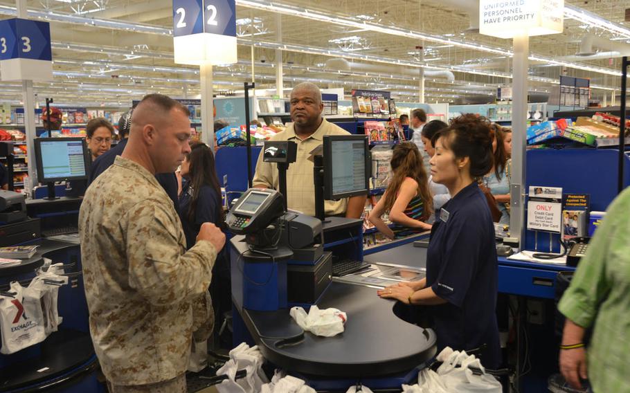 A servicemember pays for merchandise at the Exchange at Fort Belvoir, Va. The Defense Department is proposing a 1.6 percent pay raise for servicemembers in 2017, a slight increase over this year's 1.3-percent hike. 