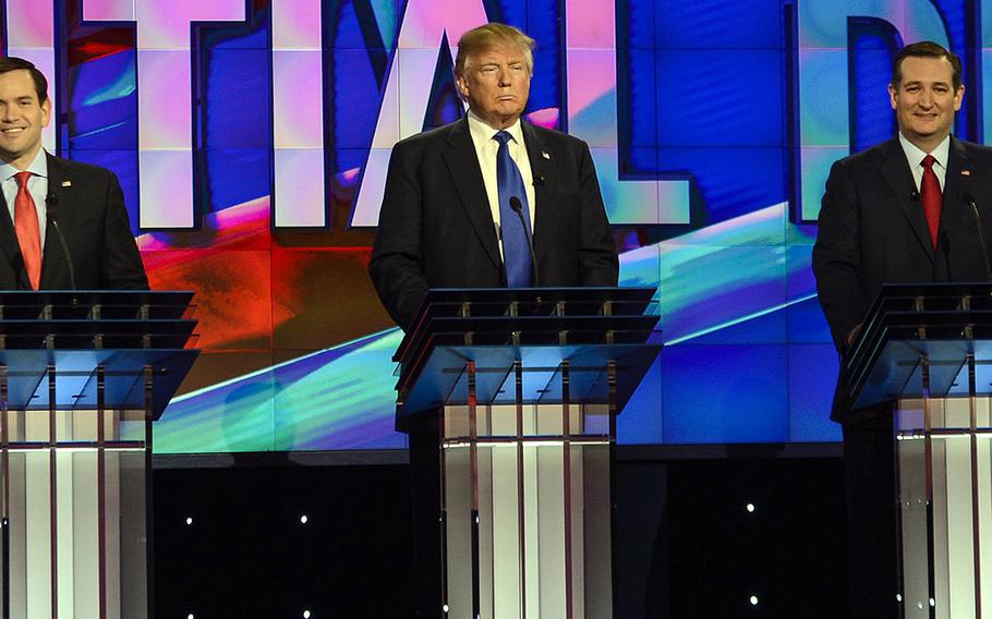Sens. Marco Rubio, left, and Ted Cruz flank businessman Donald Trump during the Republican presidential primary debate on Thursday, Feb. 25, 2016.