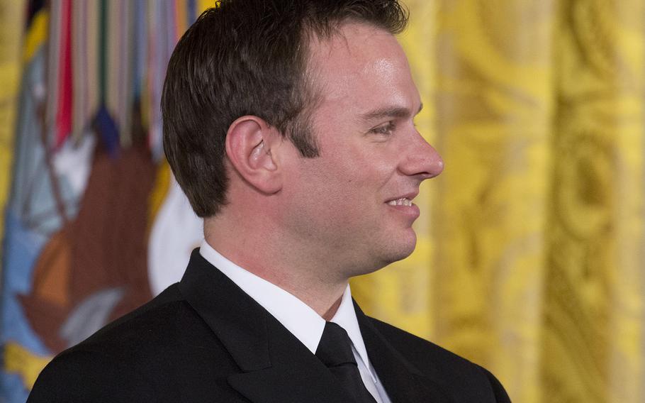 Senior Chief Petty Officer Edward C. Byers Jr. smiles as President Barack Obama talks about him during the Medal of Honor ceremony at the White House, Feb. 29, 2016.