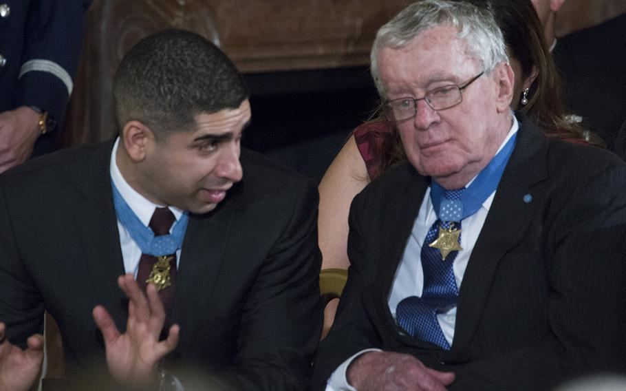Among the guests at the Medal of Honor ceremony for Senior Chief Petty Officer Edward C. Byers Jr.at the White House were previous recipients of the nation's highest military award, Florent Groberg, left, and Thomas Kelley.
