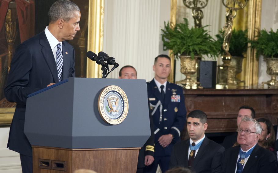 President Barack Obama acknowledges previous Medal of Honor recipients during the ceremony for Senior Chief Petty Officer Edward C. Byers Jr. on Feb. 29, 2016.