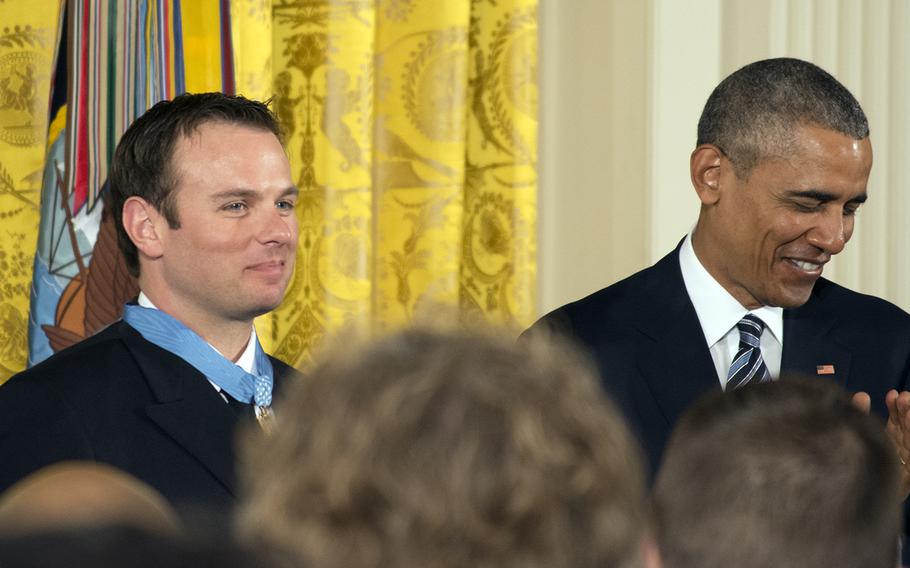 President Barack Obama claps after giving Senior Chief Petty Officer Edward C. Byers Jr. the Medal of Honor on Feb. 29, 2016.