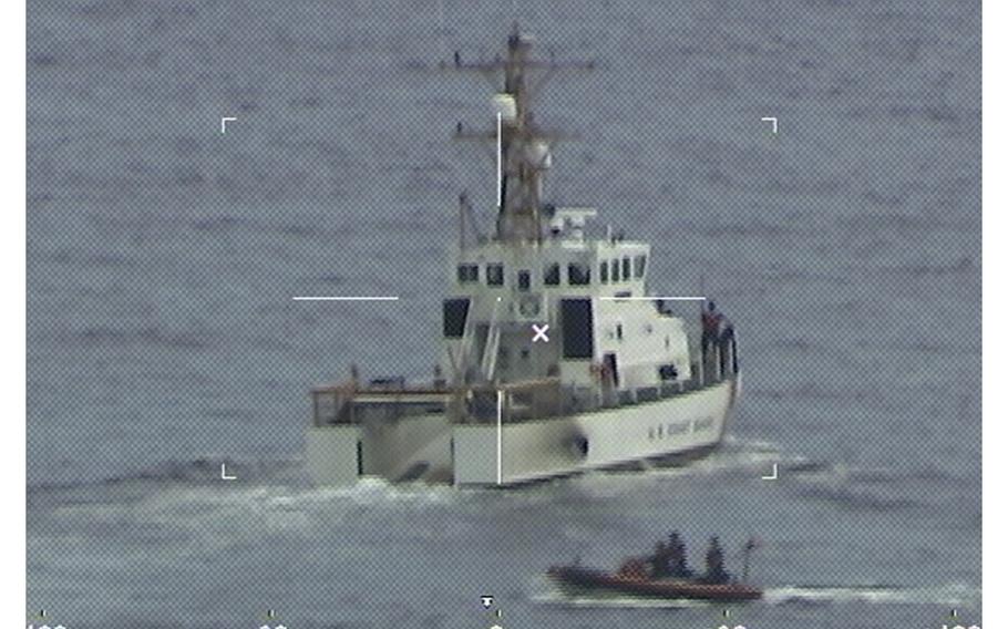 Coast Guard Cutter Ibis’ crew searching for people missing from a capsized boat off the coast of Florida, Tuesday, Jan. 25, 2022.  The Coast Guard searched through the night Wednesday for 39 people missing from a capsized boat after a solitary survivor was found clinging to the overturned hull. Crews on at least four ships and five aircraft already scanned a vast area about the size of Rhode Island on Tuesday after the man was pulled to safety. 